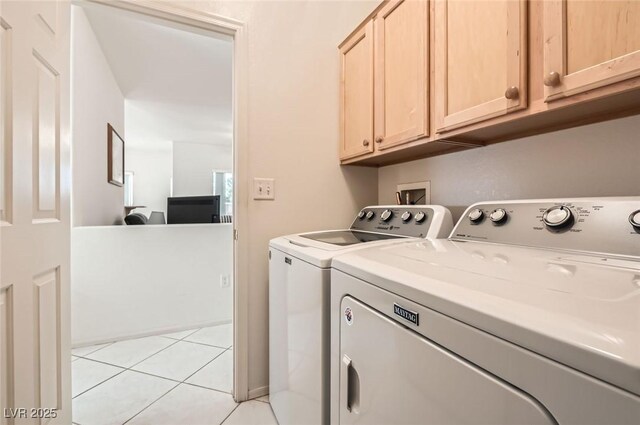 1816 Eagle Mesa Ave, Henderson, NV 89012 - washroom featuring washer and dryer, cabinet space, and light tile patterned floors