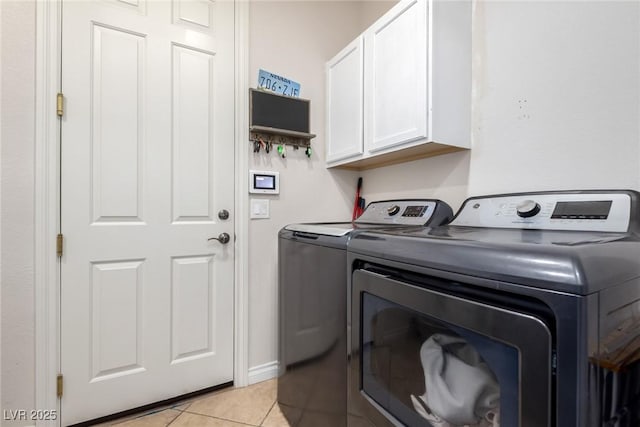 6351 Abacus Farms Ct, Las Vegas, NV 89131 - washroom featuring cabinet space, washing machine and dryer, and light tile patterned floors