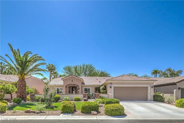 2225 Blackburn Hills Ave, Henderson, NV 89044 - mediterranean / spanish home featuring an attached garage, concrete driveway, and stucco siding