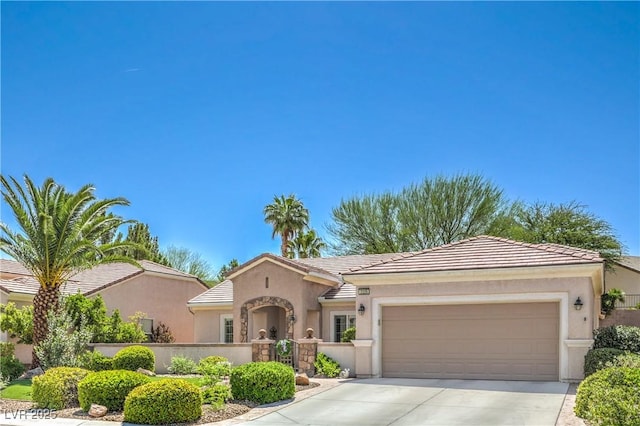 2225 Blackburn Hills Ave, Henderson, NV 89044 - view of front facade featuring driveway, an attached garage, stucco siding, and a tiled roof