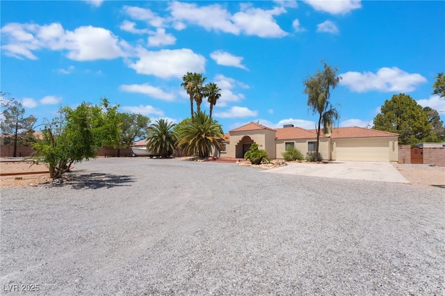 4530 W Shelbourne Ave, Las Vegas, NV 89139 - view of front of property featuring concrete driveway, an attached garage, and stucco siding