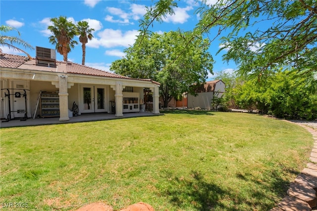 4530 W Shelbourne Ave, Las Vegas, NV 89139 - view of green lawn with french doors and a patio