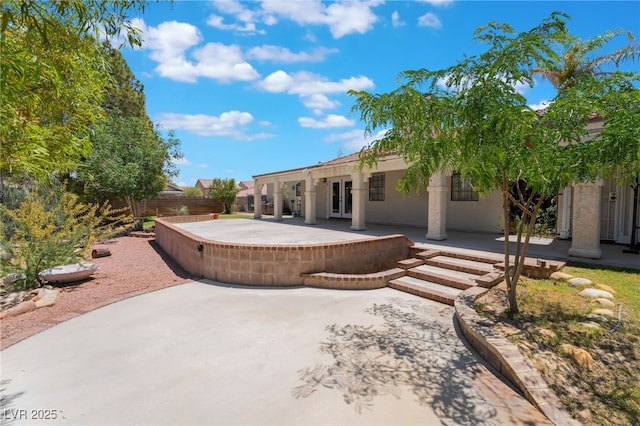 4530 W Shelbourne Ave, Las Vegas, NV 89139 - rear view of property with a patio area, french doors, and stucco siding