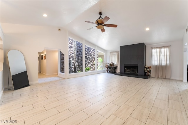4530 W Shelbourne Ave, Las Vegas, NV 89139 - unfurnished living room with plenty of natural light, ceiling fan, a large fireplace, high vaulted ceiling, and recessed lighting