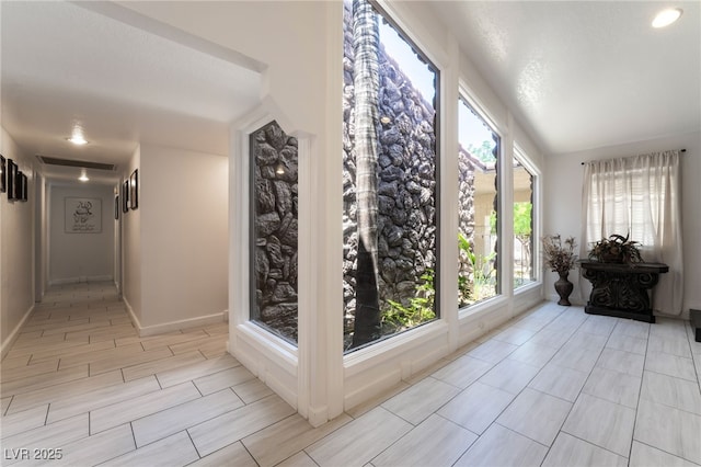 4530 W Shelbourne Ave, Las Vegas, NV 89139 - corridor featuring healthy amount of natural light