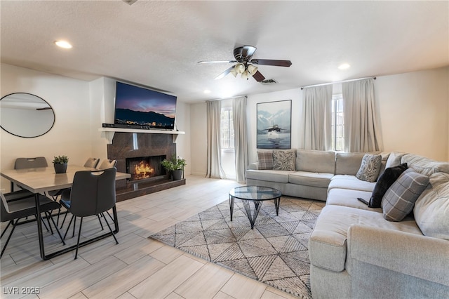 4530 W Shelbourne Ave, Las Vegas, NV 89139 - living room with a ceiling fan, a fireplace, and recessed lighting