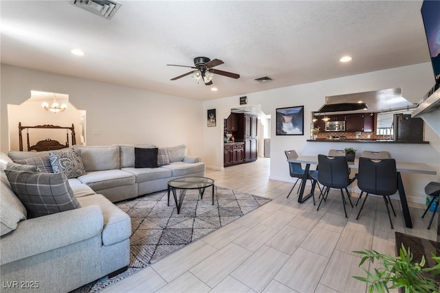 4530 W Shelbourne Ave, Las Vegas, NV 89139 - living room with ceiling fan, a chandelier, and recessed lighting