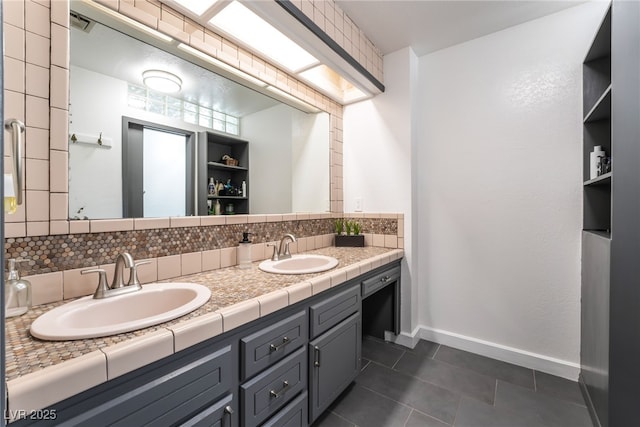 4530 W Shelbourne Ave, Las Vegas, NV 89139 - full bathroom with tile patterned floors, tasteful backsplash, and double vanity