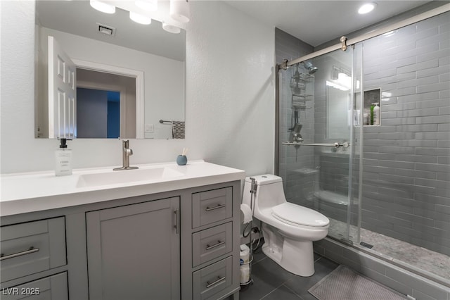 4530 W Shelbourne Ave, Las Vegas, NV 89139 - full bathroom with vanity, a shower stall, and tile patterned floors