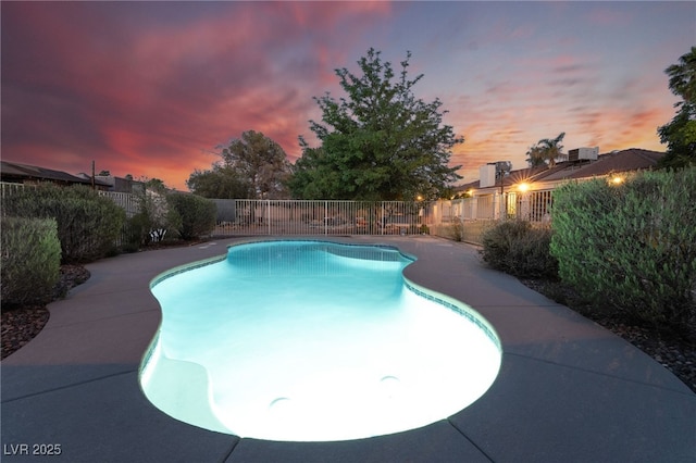 4530 W Shelbourne Ave, Las Vegas, NV 89139 - pool at dusk featuring a fenced backyard
