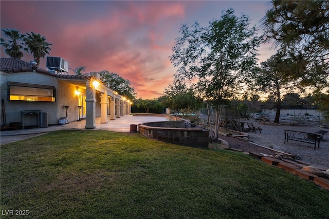 4530 W Shelbourne Ave, Las Vegas, NV 89139 - yard at dusk featuring a yard