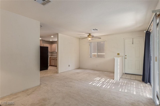 5249 Wave Dancer Ln, Las Vegas, NV 89118 - unfurnished living room featuring light carpet and ceiling fan