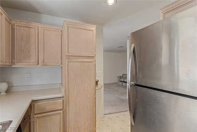 5249 Wave Dancer Ln, Las Vegas, NV 89118 - kitchen with freestanding refrigerator, light brown cabinets, light countertops, and light flooring