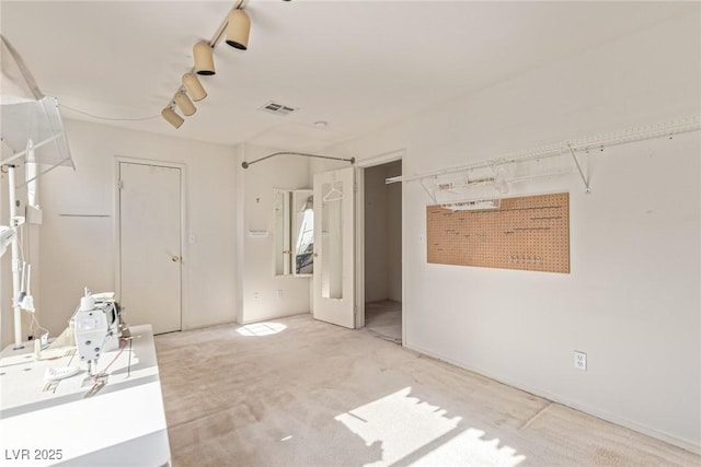 5249 Wave Dancer Ln, Las Vegas, NV 89118 - carpeted spare room featuring track lighting