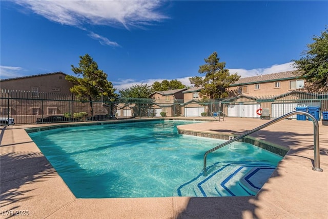 5249 Wave Dancer Ln, Las Vegas, NV 89118 - community pool with a residential view, a storage unit, and a patio