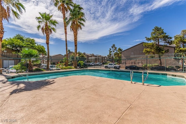 5249 Wave Dancer Ln, Las Vegas, NV 89118 - community pool with a patio and a residential view
