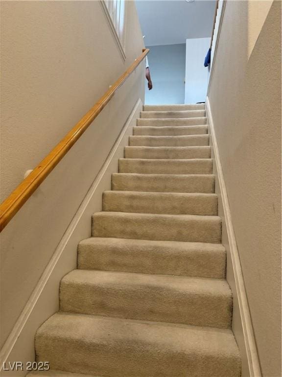 656 Peachy Canyon Cir Unit 203, Las Vegas, NV 89144 - staircase featuring a textured wall