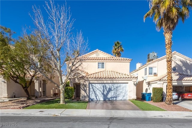 433 Jubilation Dr, Las Vegas, NV 89145 - mediterranean / spanish home featuring a tiled roof, stucco siding, concrete driveway, and a garage