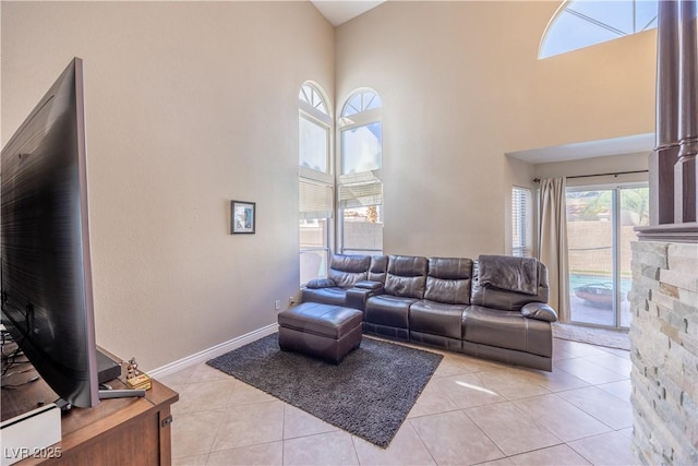 433 Jubilation Dr, Las Vegas, NV 89145 - living area featuring a towering ceiling and light tile patterned flooring
