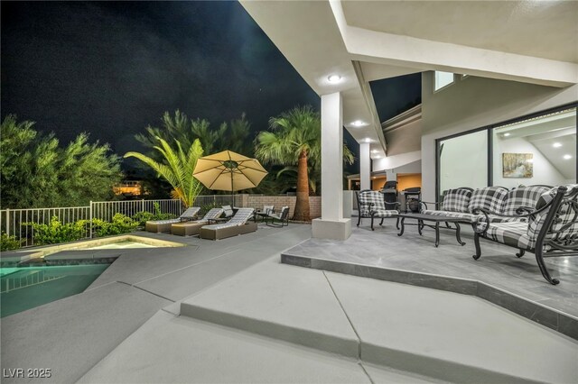 2058 Troon Dr, Henderson, NV 89074 - pool at twilight with a patio area, an outdoor living space, and a jacuzzi