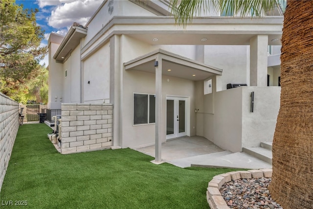 2058 Troon Dr, Henderson, NV 89074 - back of house featuring french doors, stucco siding, and a patio
