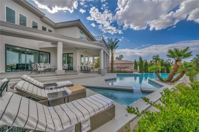 2058 Troon Dr, Henderson, NV 89074 - view of swimming pool featuring an outdoor hangout area, a patio area, and a pool with connected hot tub
