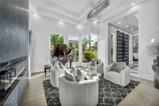 2058 Troon Dr, Henderson, NV 89074 - living room featuring wood finished floors, recessed lighting, and a high ceiling