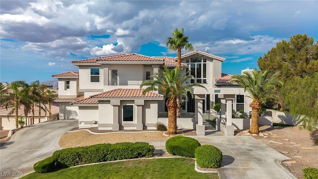 2058 Troon Dr, Henderson, NV 89074 - rear view of property featuring a tiled roof, stucco siding, and driveway