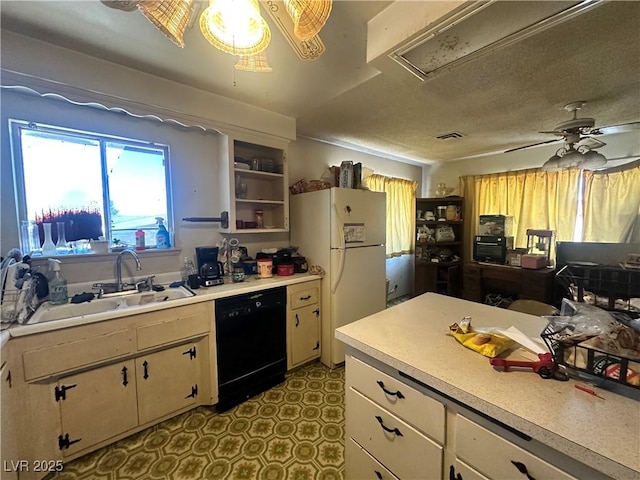 3505 W Bonanza Rd, Las Vegas, NV 89107 - kitchen featuring dishwasher, freestanding refrigerator, light countertops, ceiling fan, and tile patterned floors