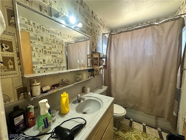 3505 W Bonanza Rd, Las Vegas, NV 89107 - full bath with vanity, shower / bathtub combination with curtain, and a textured ceiling