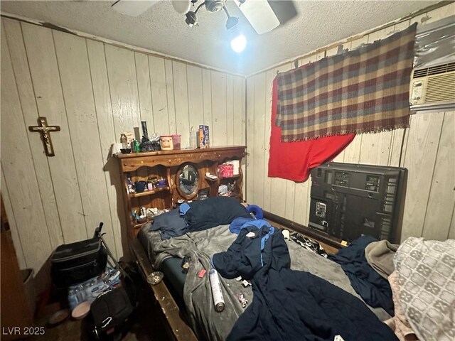 3505 W Bonanza Rd, Las Vegas, NV 89107 - bedroom featuring ceiling fan, wooden walls, and a textured ceiling