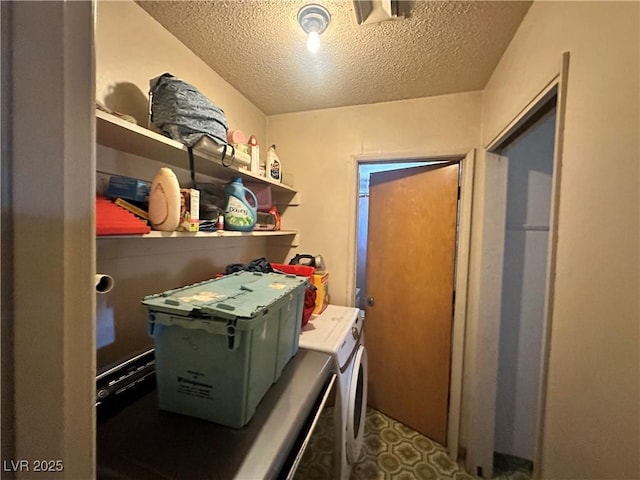 3505 W Bonanza Rd, Las Vegas, NV 89107 - laundry room with separate washer and dryer and a textured ceiling