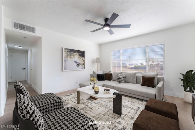 2 Utah Way, Henderson, NV 89015 - living room featuring a ceiling fan, wood finished floors, and a textured ceiling