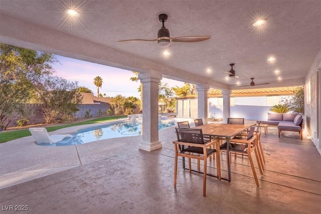 2868 Vista Del Sol Ave, Las Vegas, NV 89120 - patio terrace at dusk featuring a ceiling fan, a fenced backyard, and a patio