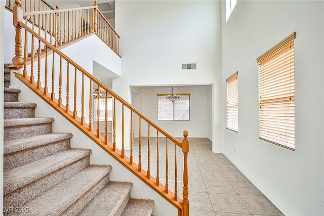 9122 Mountain Maple Ct, Las Vegas, NV 89148 - stairway featuring a high ceiling and tile patterned flooring