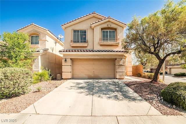 9122 Mountain Maple Ct, Las Vegas, NV 89148 - view of front of home with a tiled roof, concrete driveway, stucco siding, and an attached garage