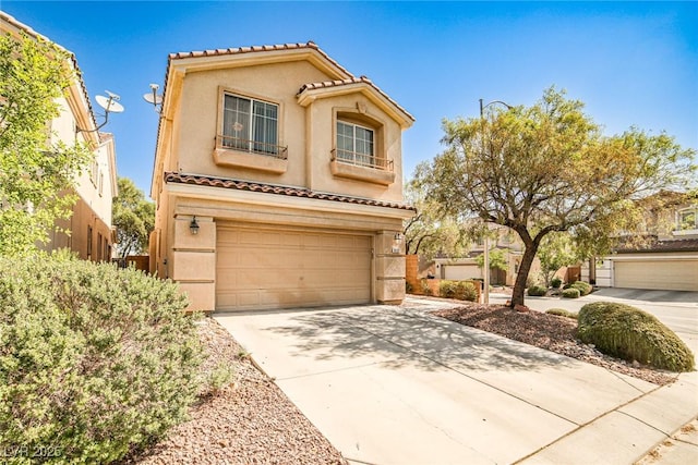 9122 Mountain Maple Ct, Las Vegas, NV 89148 - mediterranean / spanish house featuring an attached garage, stucco siding, concrete driveway, and a tiled roof