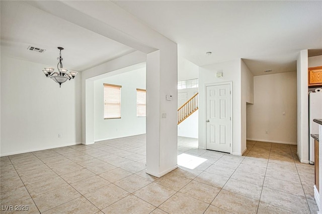 9122 Mountain Maple Ct, Las Vegas, NV 89148 - spare room with light tile patterned floors, a chandelier, and stairway