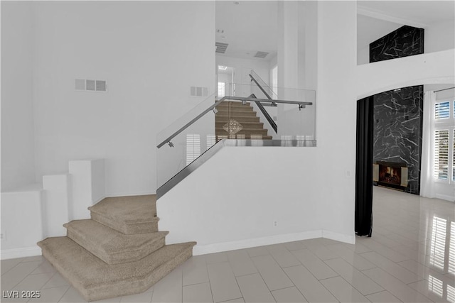 4604 Barnes Ct, Las Vegas, NV 89147 - stairs featuring a high ceiling and a premium fireplace