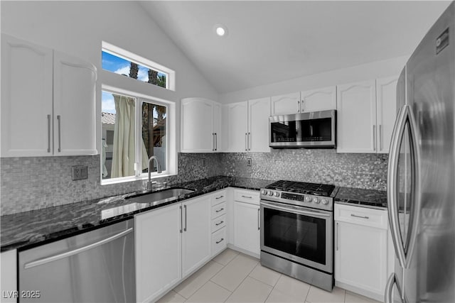 4604 Barnes Ct, Las Vegas, NV 89147 - kitchen with appliances with stainless steel finishes, dark stone counters, white cabinets, decorative backsplash, and recessed lighting