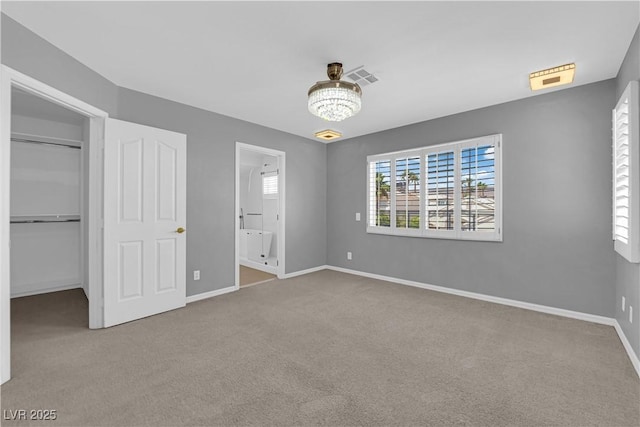 4604 Barnes Ct, Las Vegas, NV 89147 - unfurnished bedroom featuring carpet floors, a walk in closet, ensuite bathroom, and a closet