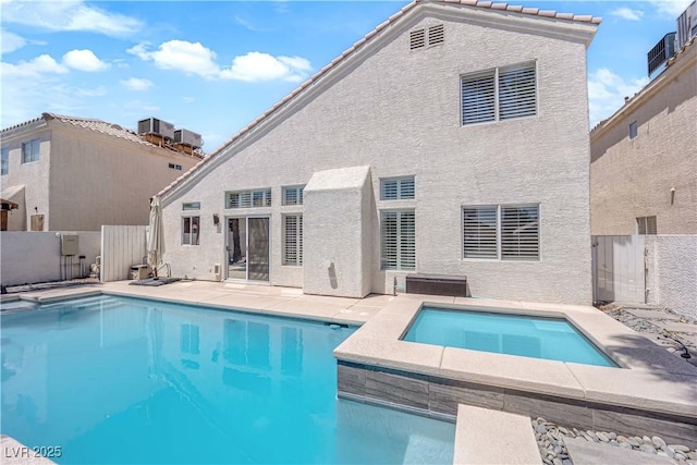 4604 Barnes Ct, Las Vegas, NV 89147 - swimming pool with an in-ground hot tub, a fenced backyard, a gate, and a patio area
