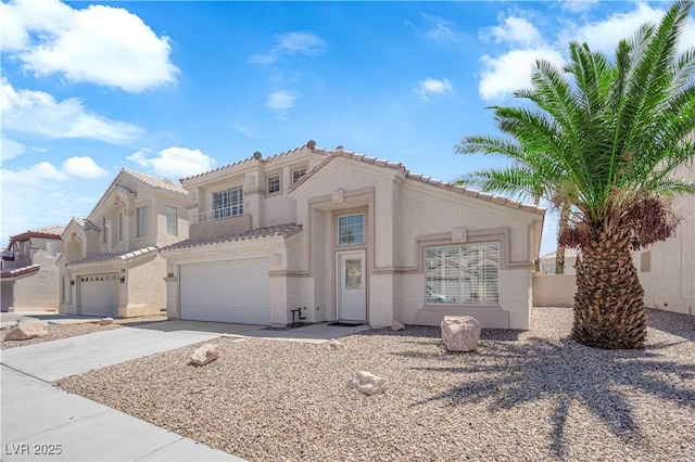 4604 Barnes Ct, Las Vegas, NV 89147 - mediterranean / spanish-style house with concrete driveway, stucco siding, a tile roof, and a garage