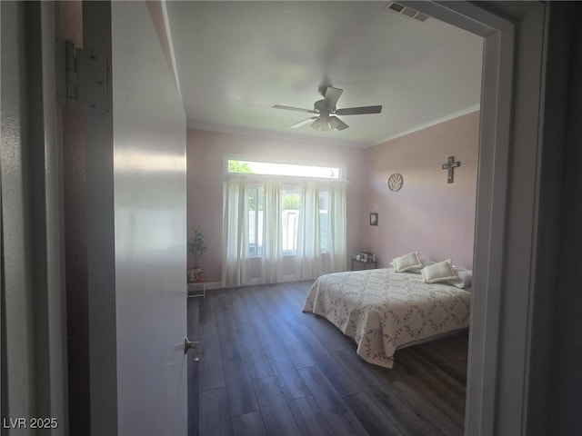 4764 Wild Draw Dr, North Las Vegas, NV 89031 - bedroom with wood finished floors, ornamental molding, and ceiling fan