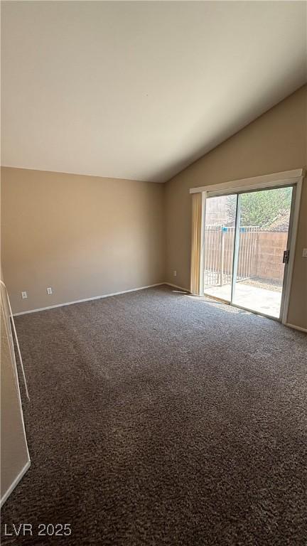 1081 Overture Dr, Las Vegas, NV 89123 - carpeted spare room featuring vaulted ceiling and baseboards