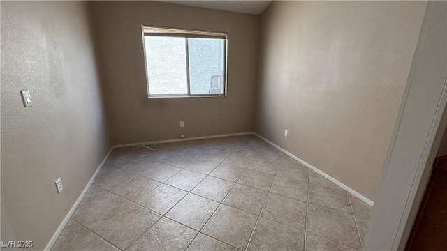 1081 Overture Dr, Las Vegas, NV 89123 - empty room featuring light tile patterned floors and baseboards