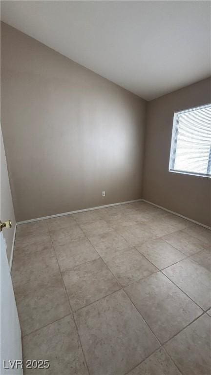 1081 Overture Dr, Las Vegas, NV 89123 - spare room with baseboards and light tile patterned flooring