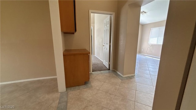 1081 Overture Dr, Las Vegas, NV 89123 - hallway with light tile patterned floors and baseboards