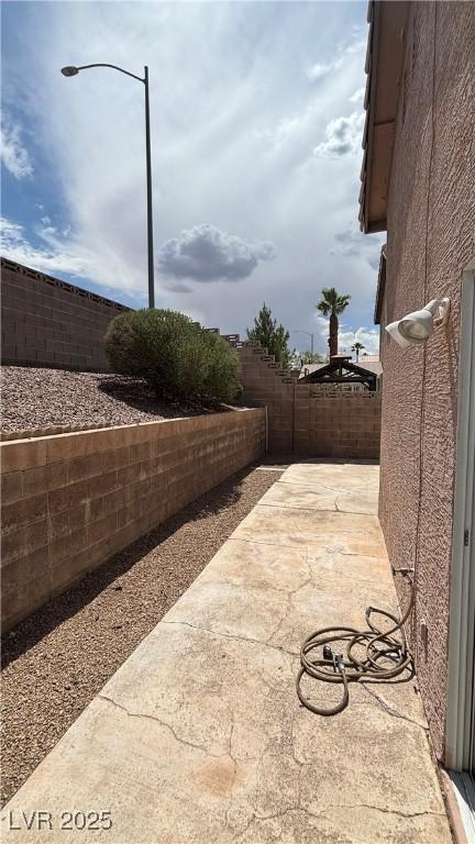 1081 Overture Dr, Las Vegas, NV 89123 - fenced backyard featuring a patio