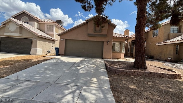 1081 Overture Dr, Las Vegas, NV 89123 - view of front of property featuring driveway, stucco siding, and a tiled roof